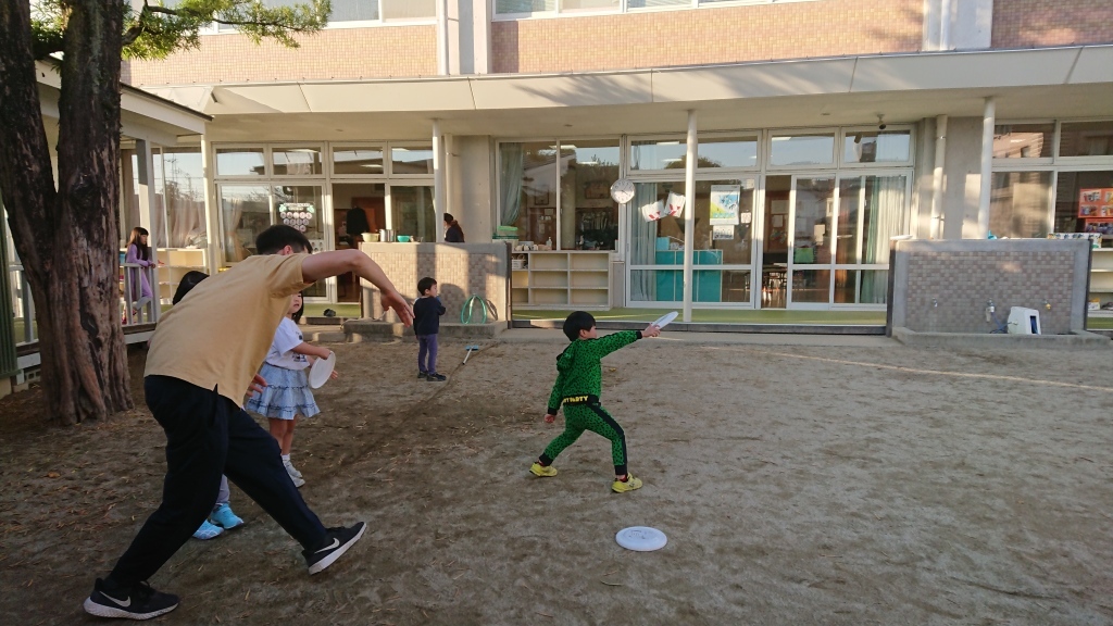 Sena flying a frisbee